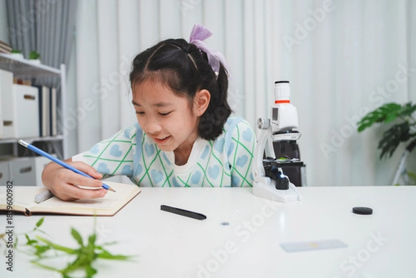 Obraz Elementary School Girl Taking Notes Science Experiment Microscope STEM Research