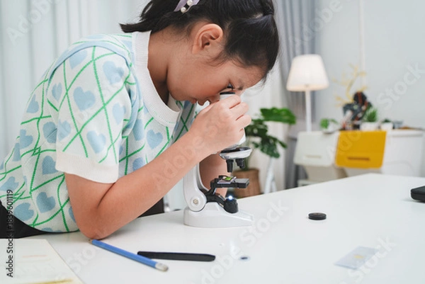 Obraz STEM focused student exploring microscope supporting future skills and digital learning growth