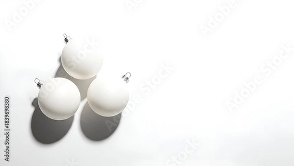 Obraz Three Matte White Christmas Baubles Casting Shadows on White