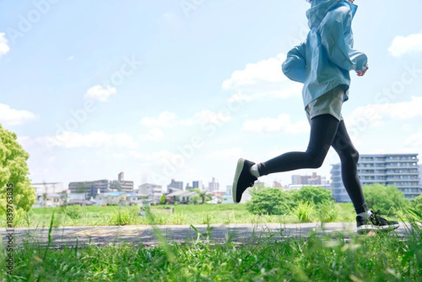 Obraz 屋外でランニングする40代女性　顔無し