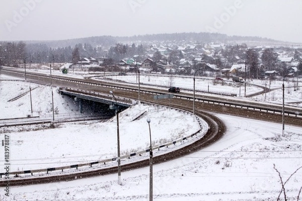 Obraz traffic junction during a snowfall on a winter day