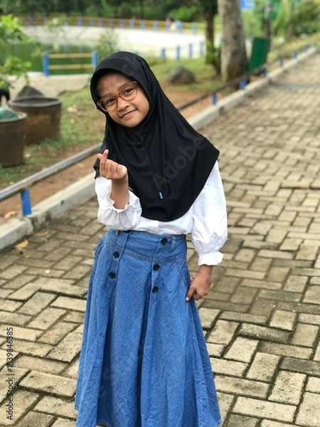 Obraz Portrait of a Hijabi Girl Wearing Glasses and Posing Naturally