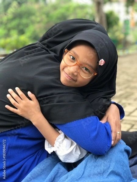 Obraz A Tender Embrace Between Mother and Her Little Girl