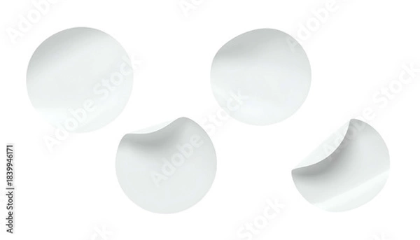 Fototapeta Four white circular objects with two partially peeled edges on a black background