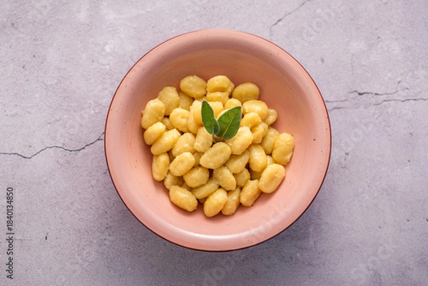 Fototapeta Italian gnocchi with butter and sage, top view