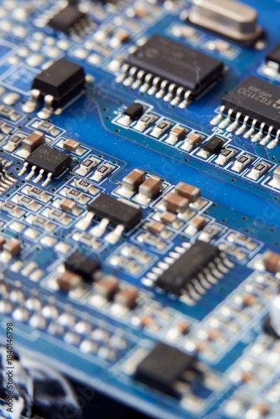 Obraz Close up of electronic circuit board with microchips and capacitors