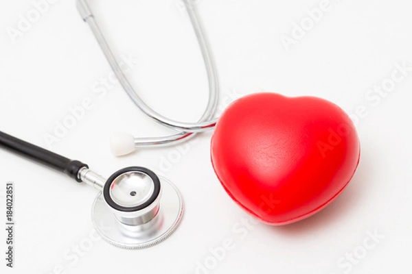 Fototapeta Red heart and a stethoscope. Isolated on white background. Studio lighting. Concept for healthy and medical