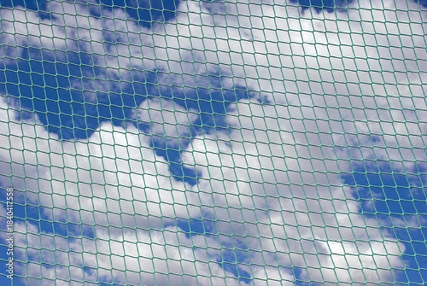 Obraz net against blue sky with clouds