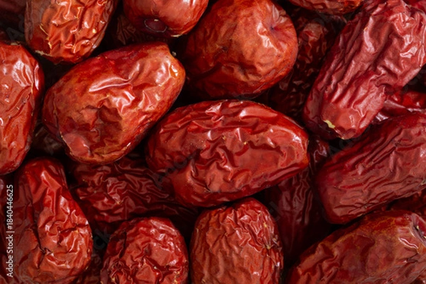 Fototapeta Pile of dried Chinese jujube fruit (red dates) for background. Close-up