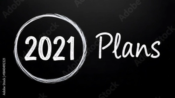 Fototapeta Chalk drawing of 2021 plans circled on a black chalkboard background for new year goal setting