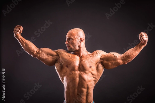 Fototapeta bodybuilder posing in studio