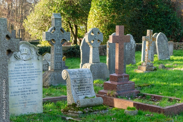 Obraz Ancient gravestones in the graveyard of Holy Cross Church in Seend, Wiltshire. 