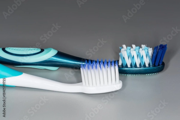 Obraz Two toothbrushes with soft and hard bristles, close-up