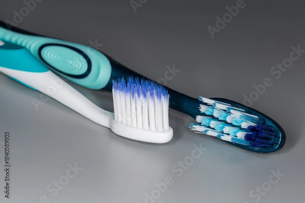 Obraz Two toothbrushes with soft and hard bristles, close-up