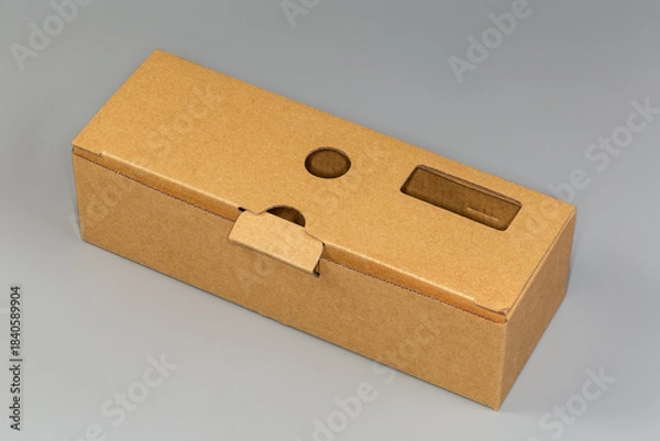 Obraz Closed rectangular long cardboard packing box on a gray background