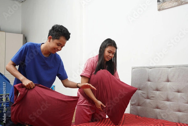 Obraz Couple Making Bed Together Indoors