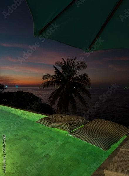Fototapeta View from luxury villa at dusk, pool lighting, sun loungers for sunbathing, umbrellas from the sun, pillows for swimming in the pool, palm tree on background