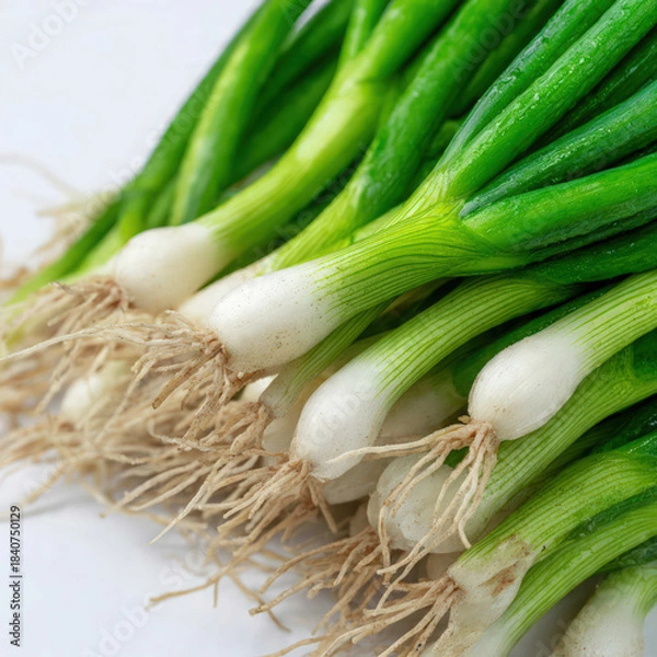 Obraz Bundle of green onions on a white background, showcasing bright color and fresh texture. Perfect for culinary blogs, ingredient collections, and market-style food imagery.