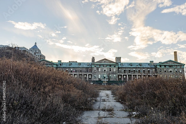 Obraz An abandoned institutional building with extensive grounds.