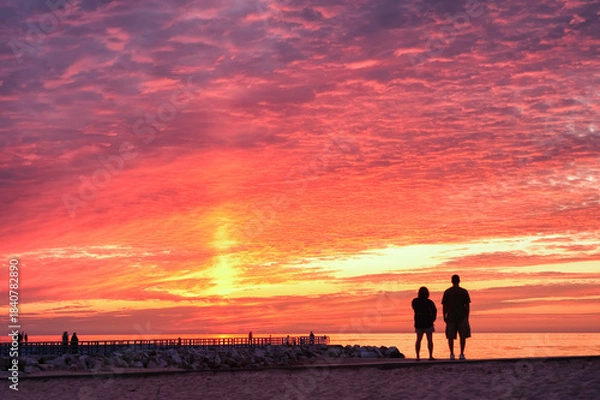 Obraz couple walking on the beach at sunset