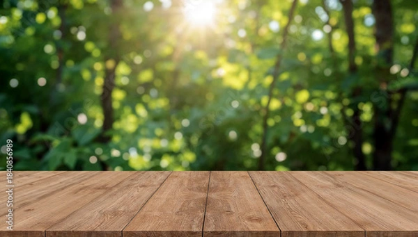 Obraz Sunlit empty wooden table in green foliage
