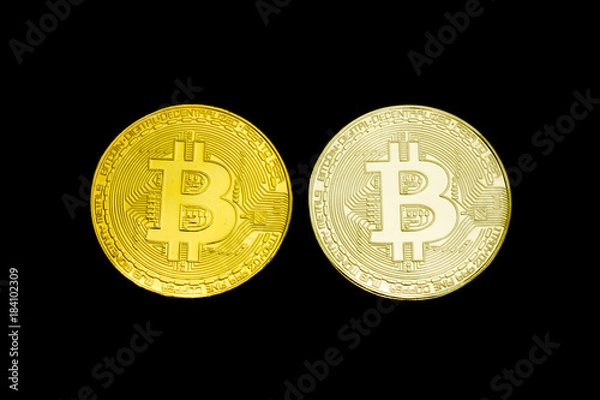 Fototapeta Silver and gold coin Bitcoin on a black background. Isolate.