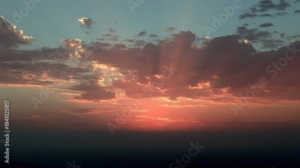 Obraz Dramatic Sunset Sky With Golden Light Rays Shining Through Clouds Over Distant Haze