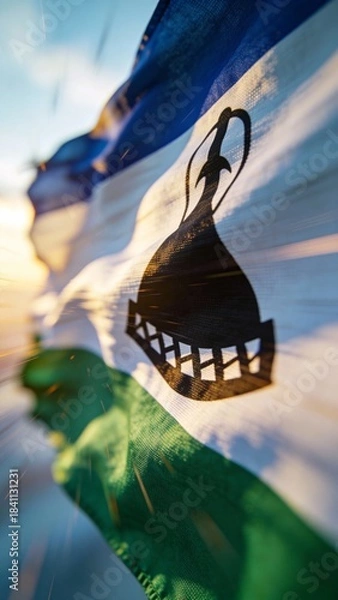 Obraz Close-up of the Lesotho flag in motion, ideal for cultural presentations or textile design projects.