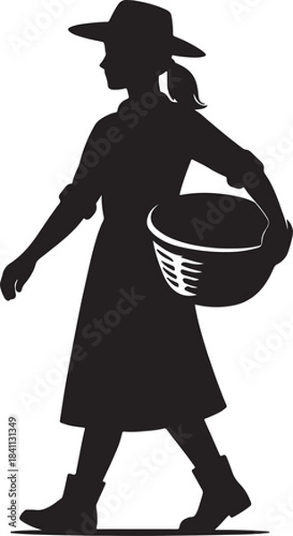 Obraz A Woman Silhouette Walking with a Basket in Hand and Wearing a Hat