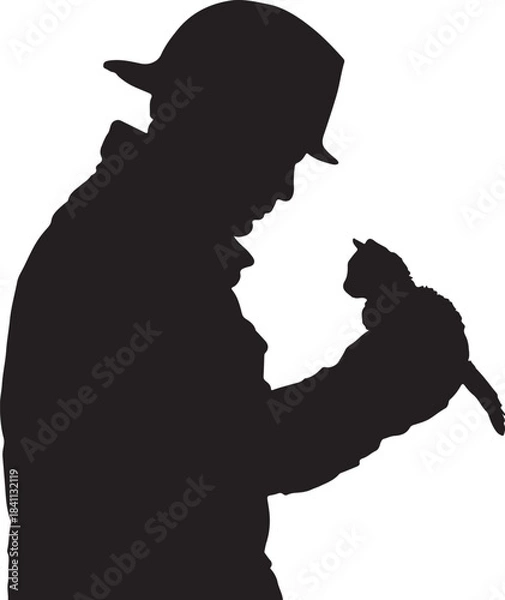 Obraz Dark silhouette of a person in a hat holding a small domestic cat