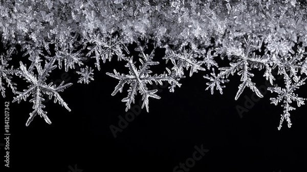 Obraz Silver hanging snowflakes border on black background. Winter holiday decoration with copy space for text
