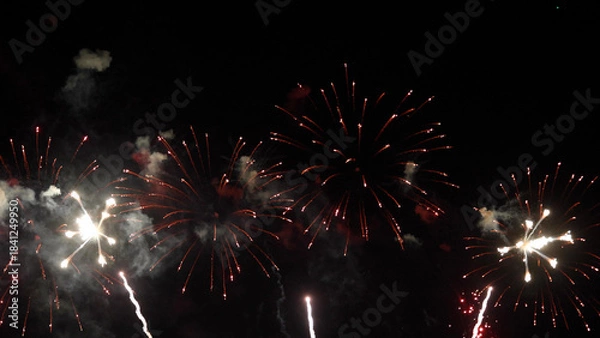 Obraz Amazing real beautiful colorful fireworks background on celebration night event for happy new year party, Abstract Multi color golden firework in the night sky