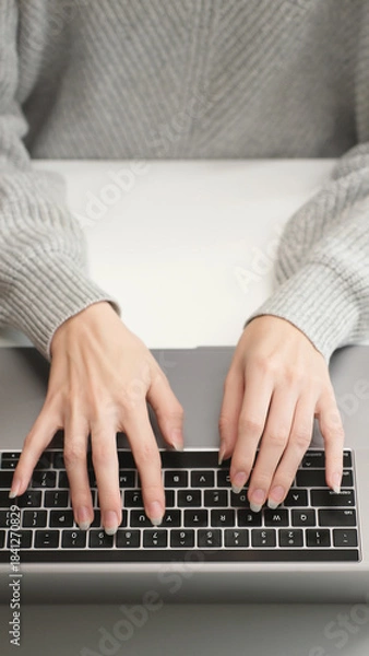 Obraz Top view of woman's hands typing on laptop keyboard, close-up. Work, AI prompt, research, social networks, and remote education in a modern workspace.