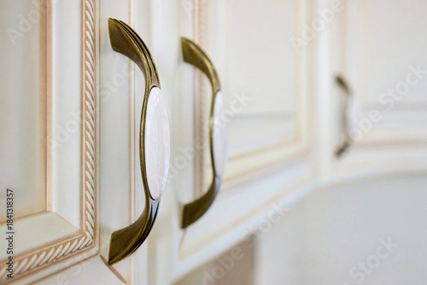 Fototapeta Zinc Alloy Antique Bronze Ceramic White Cabinet Handles selective focus close up shot. Country House Porcelain Handles.