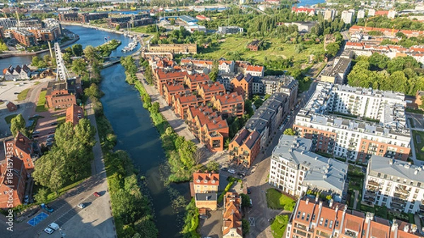 Fototapeta Aerial view of old town of Gdansk with colorful buildings, riverside architecture and urban scenery.