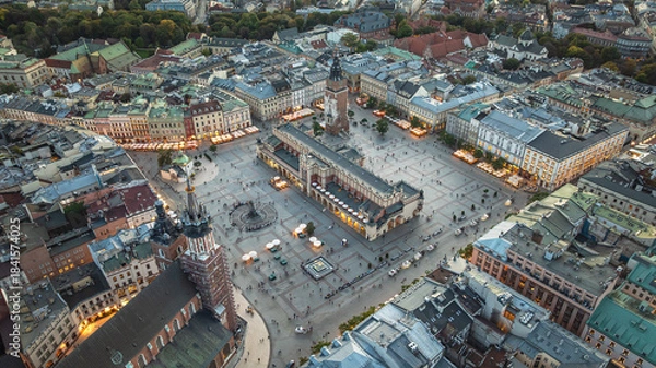 Fototapeta Dron view of Krakow s Main Market Square with Cloth Hall, Town Hall Tower and historic architecture.