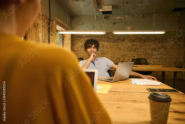 Obraz Man a focused on his laptop screen