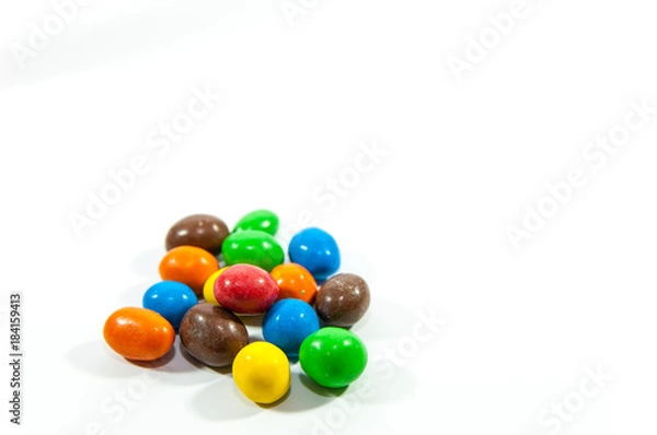 Fototapeta Colorful, popular peanuts with sugar glazure isolated on white background.
