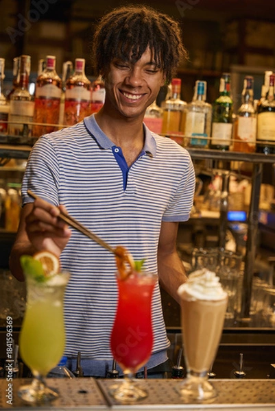 Obraz Adult man behind bar with multiple drinks