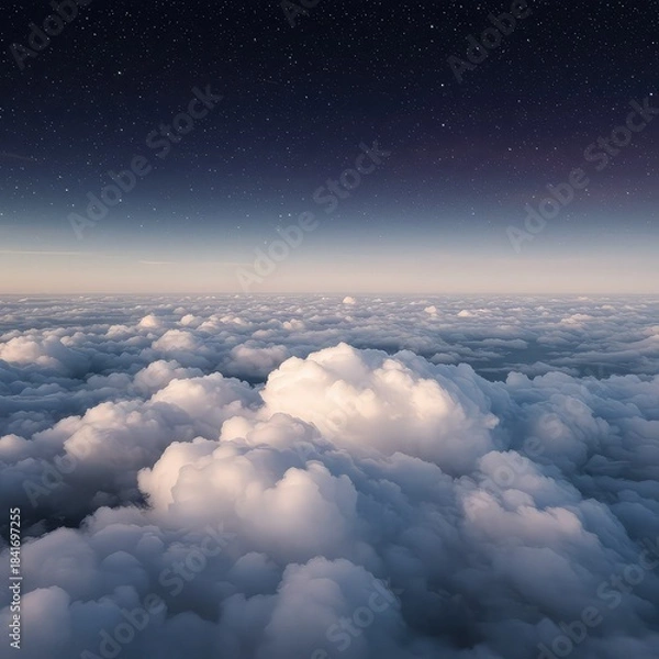 Obraz Aerial view of fluffy white clouds under a starry night sky with a gradient of dark blue to light pink hues