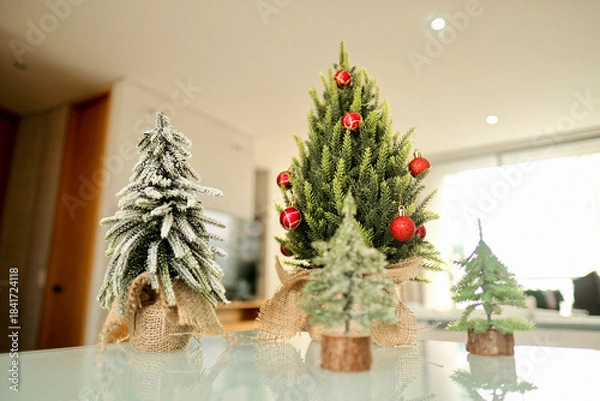 Obraz Modern appartment with 4 tiny christmas trees.