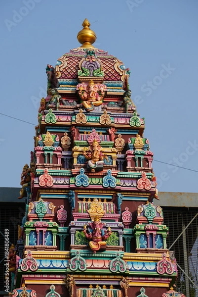 Fototapeta Colorful Hindu Temple Tower with Intricate Sculptures in India