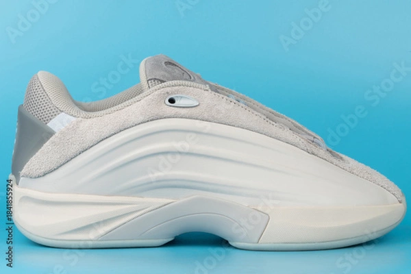 Obraz Modern sneaker design on blue background with side view