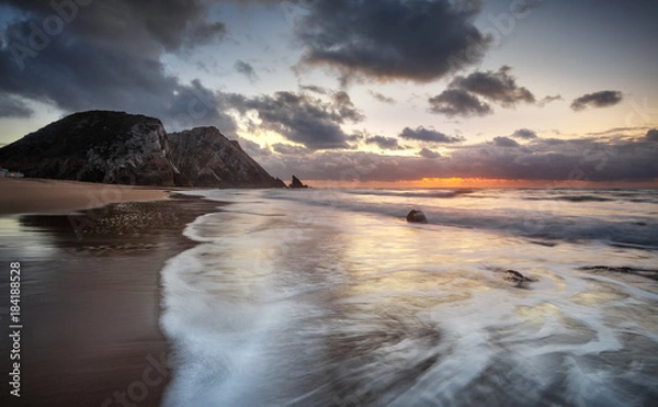 Obraz The ocean, one beach and a orange sunset