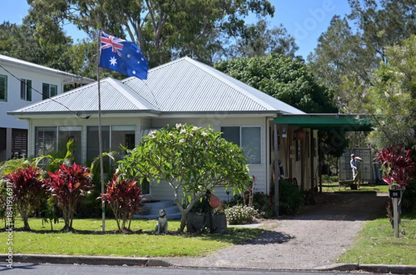 Fototapeta Astralia's national flag fly above Australian home