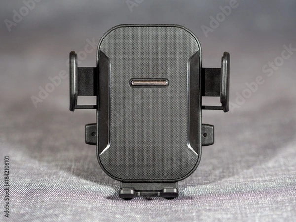 Fototapeta Car vent phone holder. Universal hands free car phone stand. Car phone holder with horizontal or vertical adjustable position