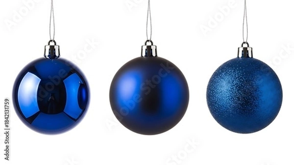 Fototapeta Three blue christmas baubles with different textures hanging against a white background