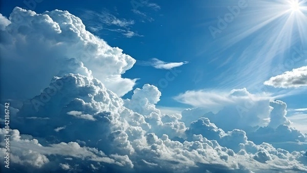 Fototapeta Cloudscape Serenity: A panoramic vista of billowing clouds, illuminated by the radiant sun, creating a sense of peace and boundless freedom. 
