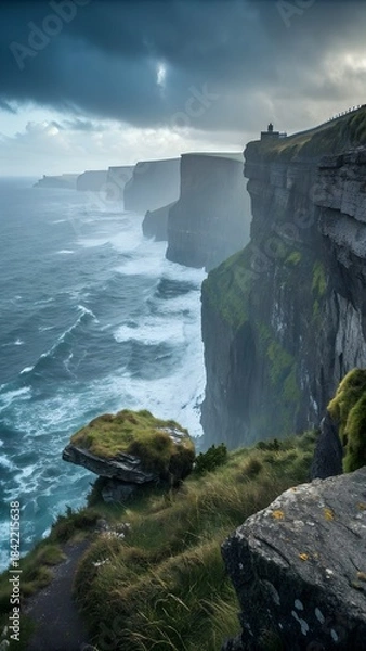 Fototapeta Dramatic Cliffs and Sea: The sheer majesty of the cliffs along the coastline. Rugged terrain and crashing waves and under the ominous sky and natural beauty