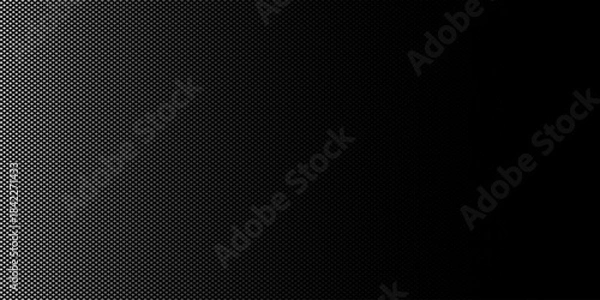 Fototapeta An abstract black and white vector background featuring a gradient created by a pattern of small dots. 